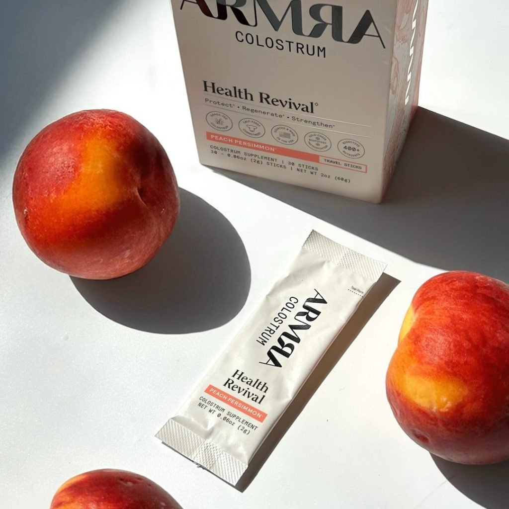 ARMRA Colostrum Peach Persimmon Travel Sticks, förpackning med 30 portionspåsar